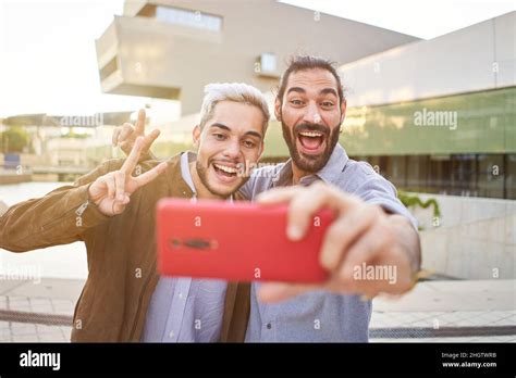 Happy Gay Couple Taking Smiling Selfie With Smartphone Homosexual People Having Fun Together