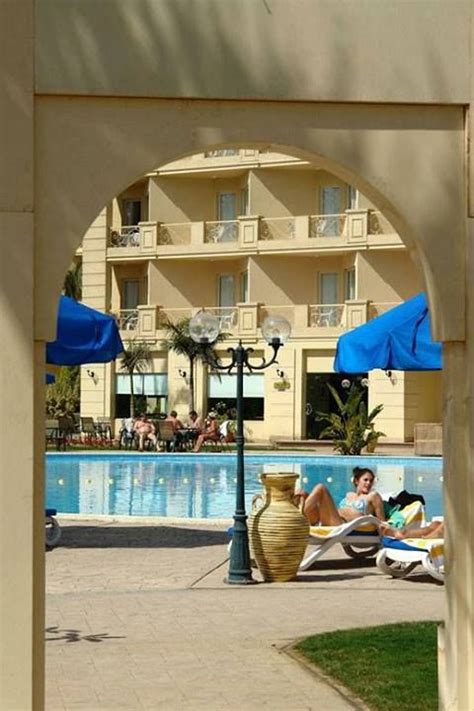 Enjoy A Sunbath At Grand Pyramids Hotel Swimming Pool Hotel Swimming