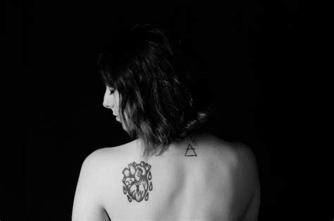 Premium Photo Rear View Of Shirtless Woman With Tattoos On Back