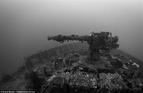 Japan's underwater graveyard: Incredible pictures of sunken planes, tanks and submarines show ...