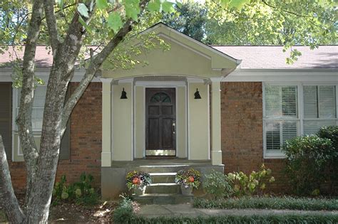 Gable Roof Portico With Arched Entry On A Ranch Style Home Designed