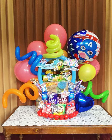 An Arrangement Of Balloons And Other Items On A Table