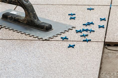 Installation of floor tiles 16295700 Stock Photo at Vecteezy