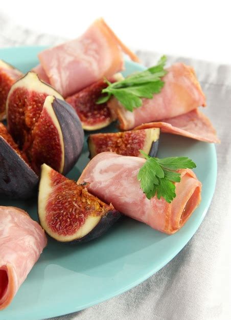 Premium Photo Tasty Figs With Ham Isolated On White