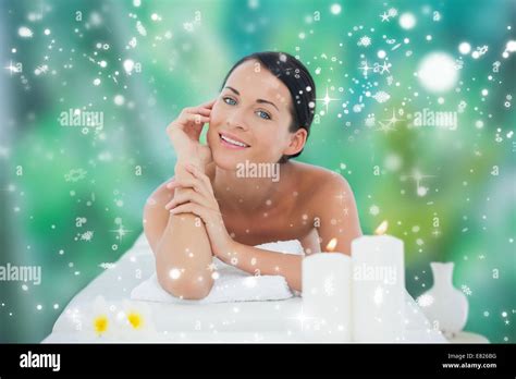 Beautiful Brunette Relaxing On Massage Table Smiling At Camera Stock Photo Alamy