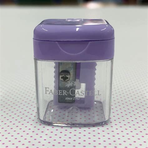 A Purple Plastic Container Sitting On Top Of A White Table Covered In