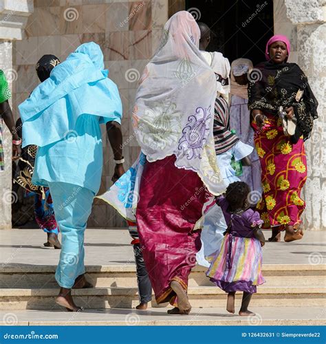 Unidentified Senegalese People in Long Traditional Clothes Walk