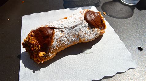 A Chocolate Filled Cannoli At A Bar In Downtown Catania Sicily