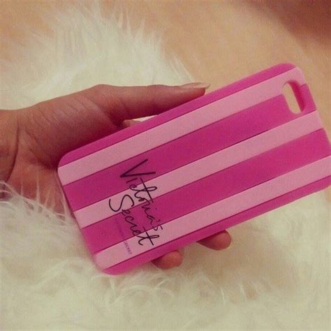 A Person Holding A Pink Case With Writing On It