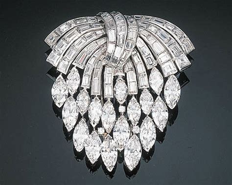 An Impressive Diamond Set Cascade Brooch The Surmount Comprising A