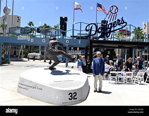 Sandy Koufax Poses Next To His Statue As The Los Angeles Dodgers Unveil It In The Centerfield