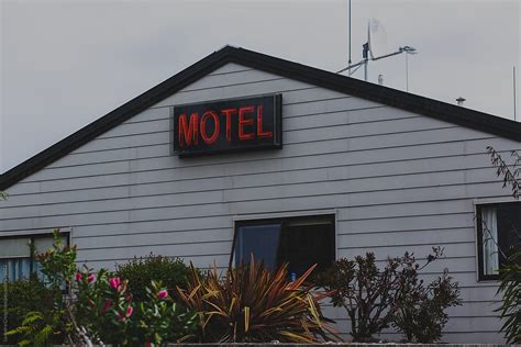 "Neon Sign Of A Motel" by Stocksy Contributor "Ohlamour Studio" - Stocksy