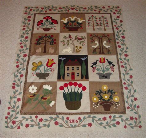 Wool Applique Quilt On Linen Background At Home In The Garden