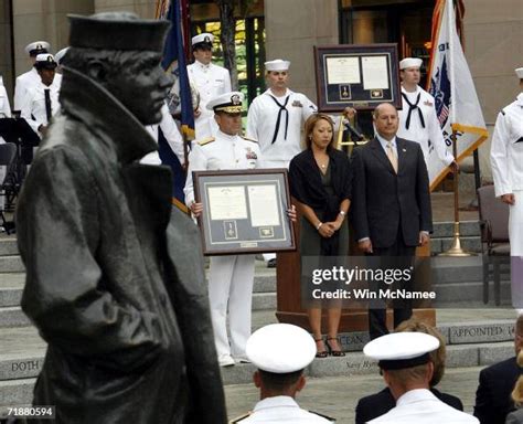 Cindy Axelson , wife of Navy SEAL Matthew G. Axelson, receives the ...