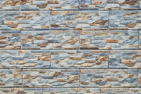 Brick wall background. Decorative finishing of building facade. Stone ...