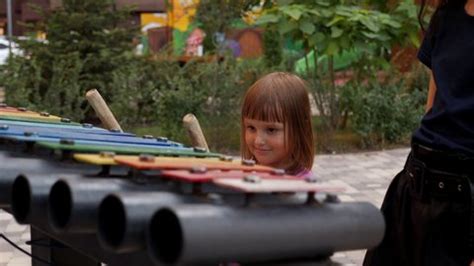 Little Girl Playing Large Outdoor Xylophone Stock Footage Video (100% ...