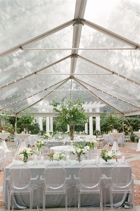 White Pillar Candles And Greenery Atop Cocktail Tables Wedding Modern