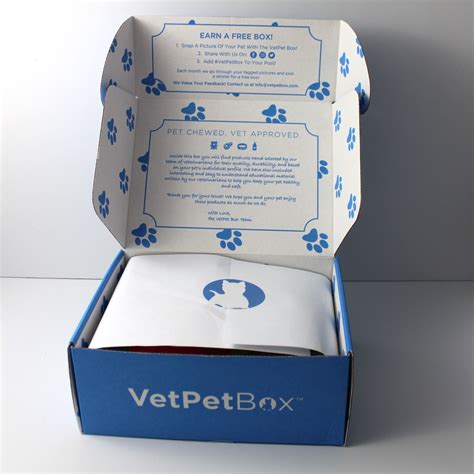 An Open Blue Box With White Dog Paw Prints On The Front And Side