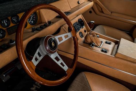 an interior view of a car with the steering wheel and dash board ...