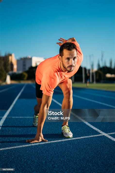 Young Athlete Man At Starting Position Ready To Start A Race Sprinters