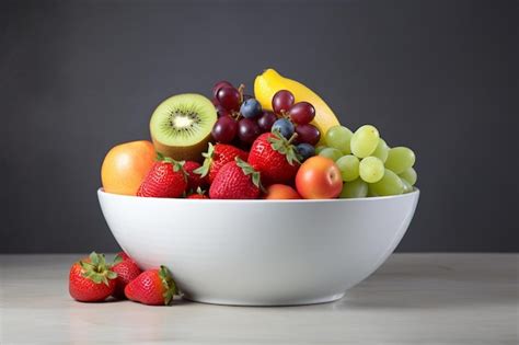 Premium Photo | A bowl of fruit including a banana, strawberries, and ...