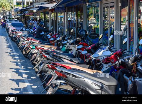 Parked motor scooters hi-res stock photography and images - Alamy