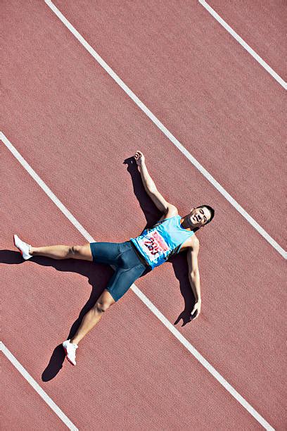 30 Tired Athlete Man Lying On Running Track Stock Photos Pictures