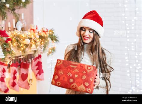 Attractive Brunette In Christmas Hat Stock Photo Alamy