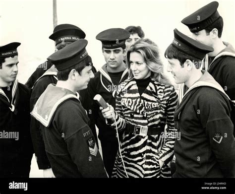 Italian showgirl Paola Piccini with sailors of the Italian Navy Stock ...