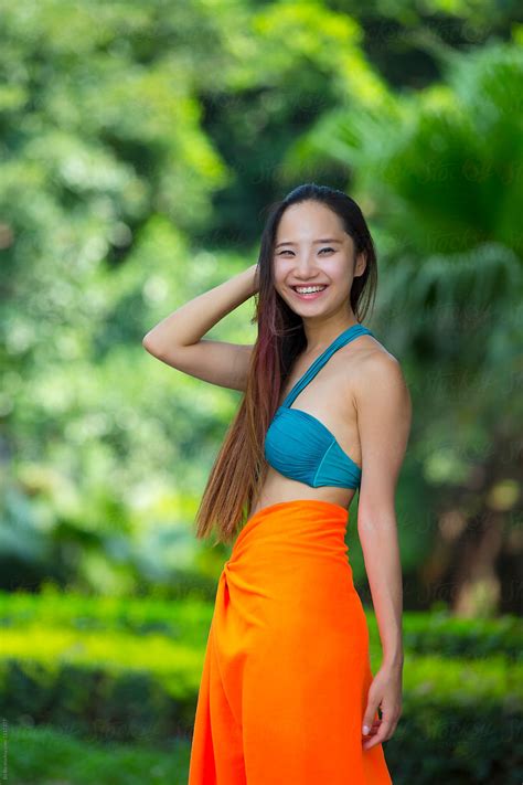 Pretty Young Asian Or Chinese Woman Wearing Bikini In The Garden By Stocksy Contributor Bo Bo