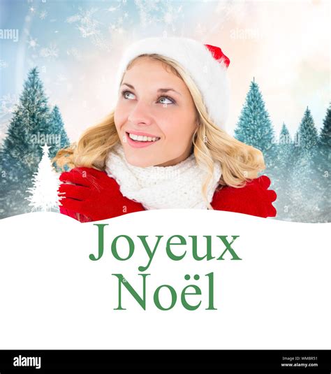 Happy Festive Blonde Against Joyeux Noel Stock Photo Alamy
