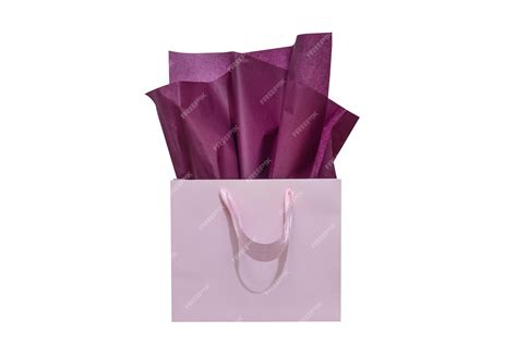 Premium Photo | Craft paper gift bag with tissue paper isolated on a ...