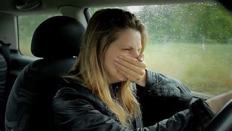 Sad Desperate Young Woman Crying While Driving Car On A Dark Rainy Day