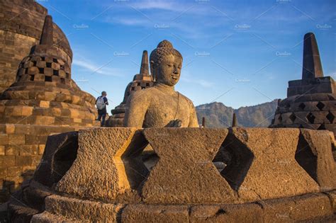 Ancient Buddha statue at Borobudur | Architecture Stock Photos ...