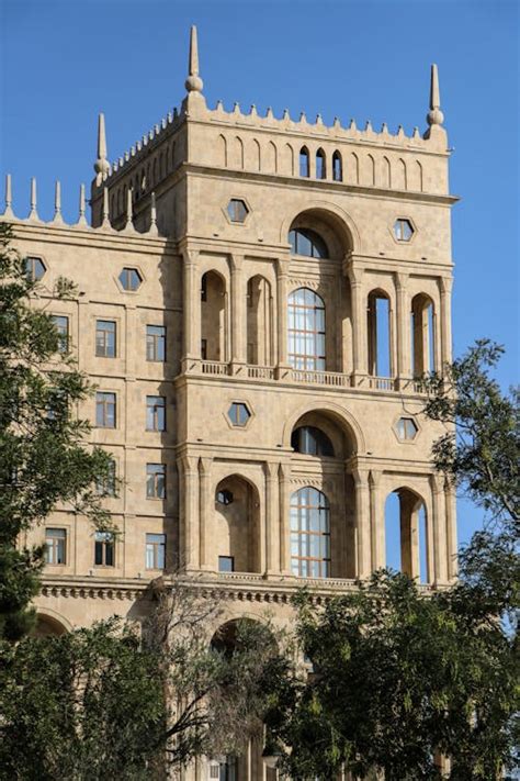 Old Historic Building Facade on Blue Sky · Free Stock Photo