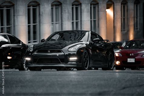 Black Nissan Skyline GTR stopped at a red light in traffic Stock Photo ...