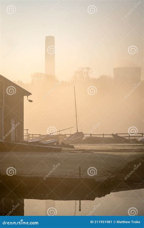 Empty Abandoned Sail Boat Club Yard Shrouded In Fog And Mist With Boats