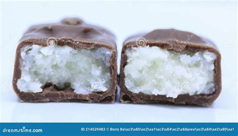 A Close Up View Of Cross Section Of Cocoa Chocolate Bar On White