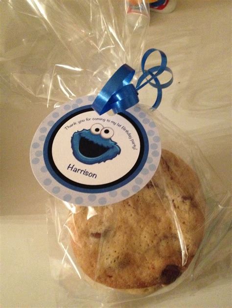 A Cookie Wrapped In Plastic With A Blue Ribbon