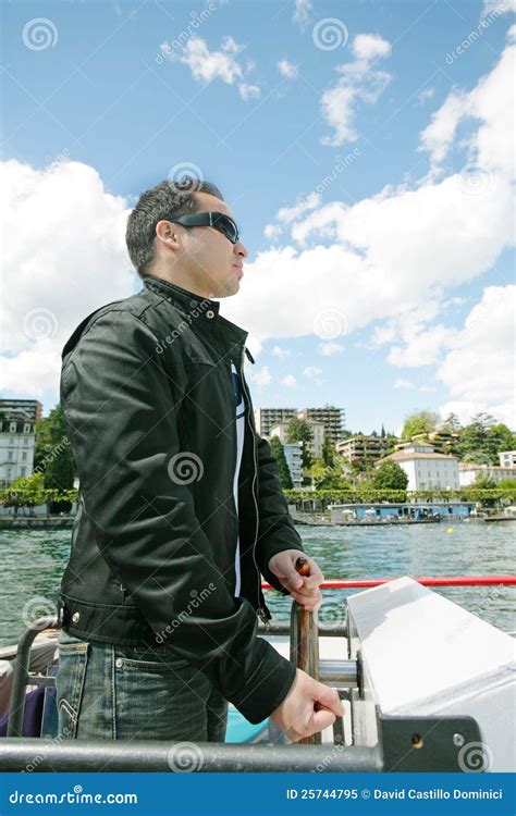 Man Driving A Boat In A Beautiful Landscape Royalty Free Stock Photo