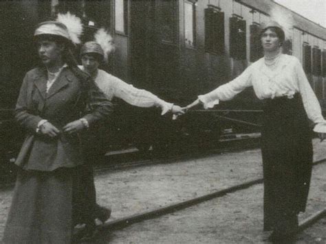 Olga And Tatiana Balancing On Train Tracks While Anastasia Walks Ahead