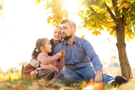 Happy Family at Sunset Walking in the Park in Autumn Stock Image ...