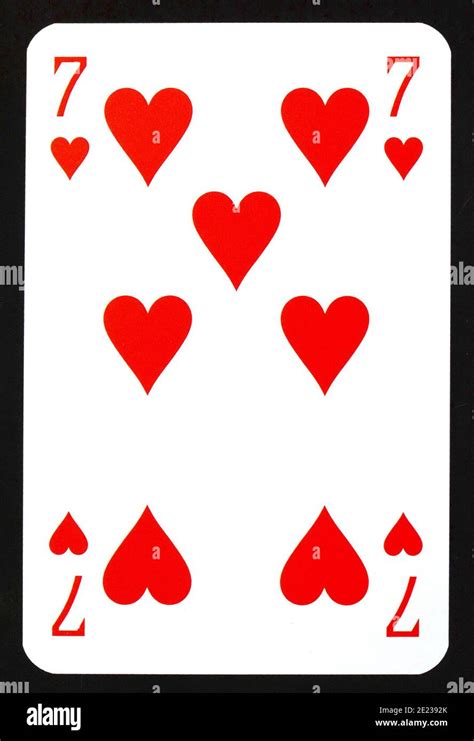 Seven Of Hearts Playing Card Isolated On Black Stock Photo Alamy