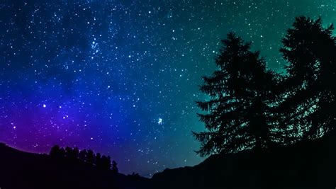 Stock Video Clip of Time lapse purple night sky stars over | Shutterstock