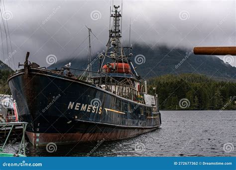 Wooden Fishing Boat Nemesis Is Docked At A Pier In A Tranquil Lake