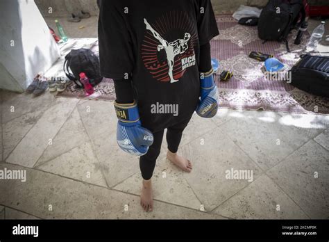 An Afghan Female Refugee Kickboxer Prepares For An Exercise Session In