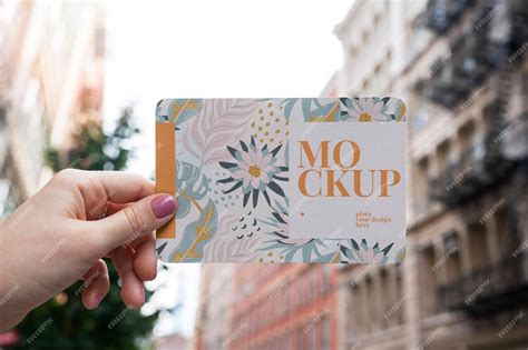 premium psd paper mockup design held  hand