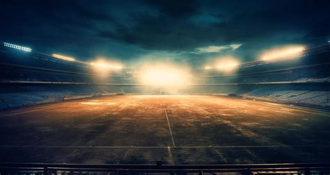 Premium Photo | A football stadium at night with smoke rising from the ...