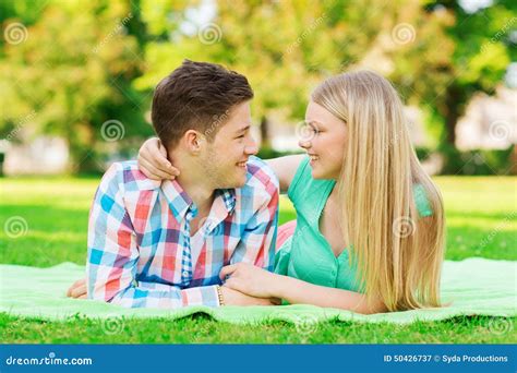 Smiling Couple Lying On Blanket In Park Stock Image Image Of