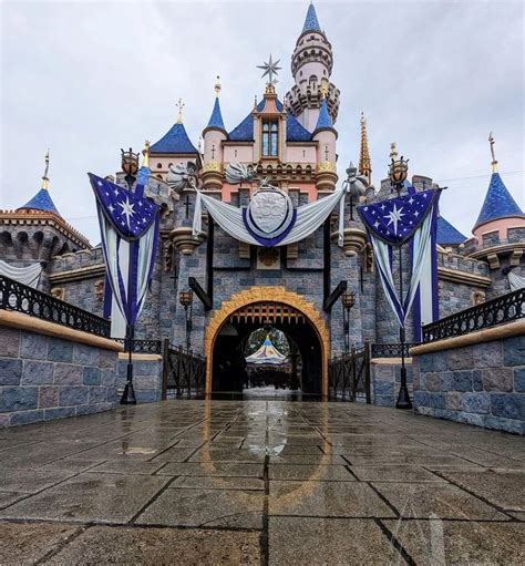 the entrance to disneyland's castle is decorated in blue and white